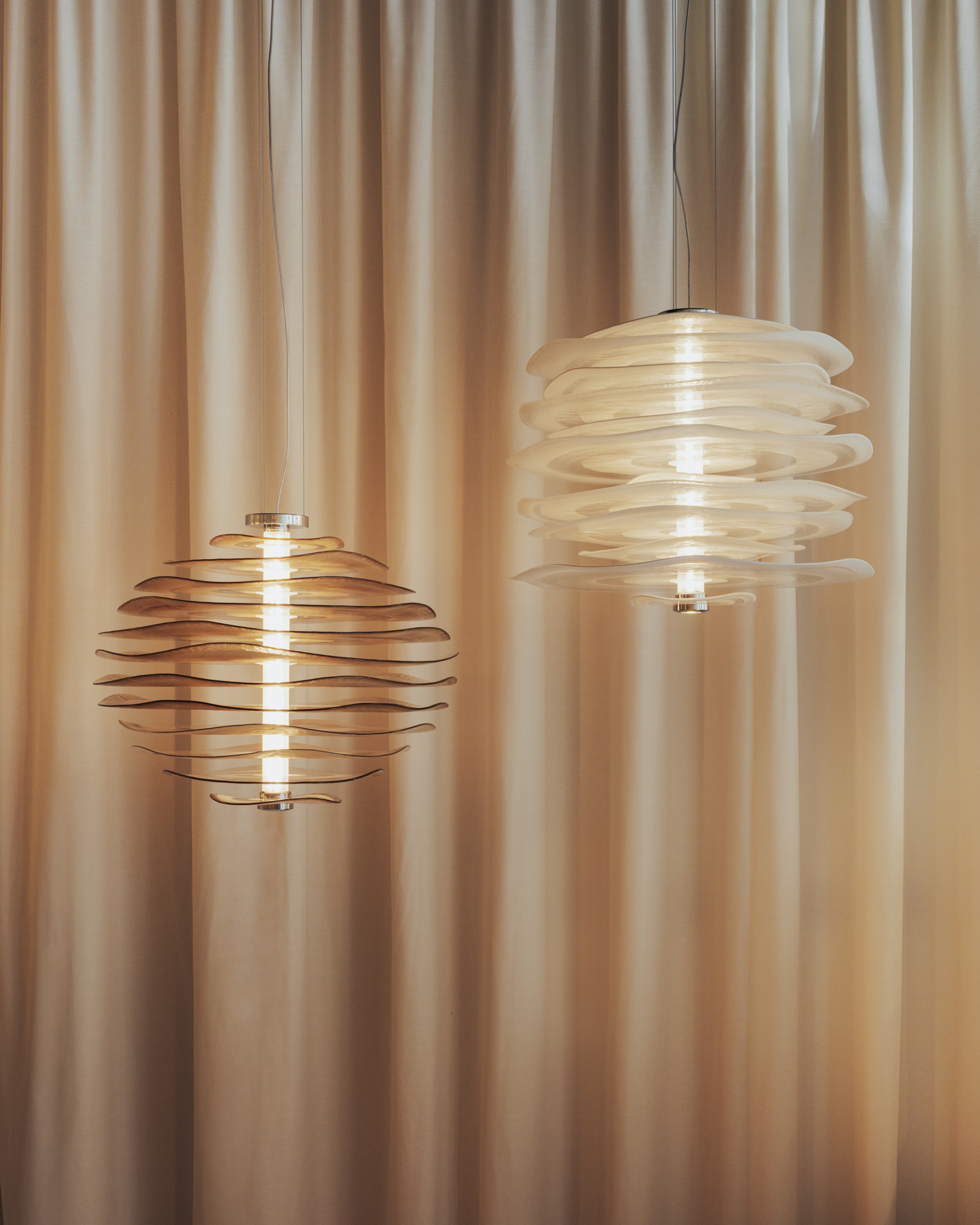 glass lamps in front of a curtain