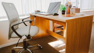 Lifestyle image of an office chair at a desk