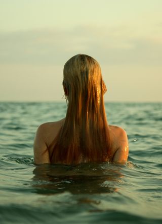 Woman wild swimming