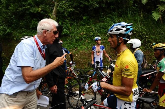 UCI official Martin Bruhn explains the fallen tree situation to Hossein Askari (TPT)
