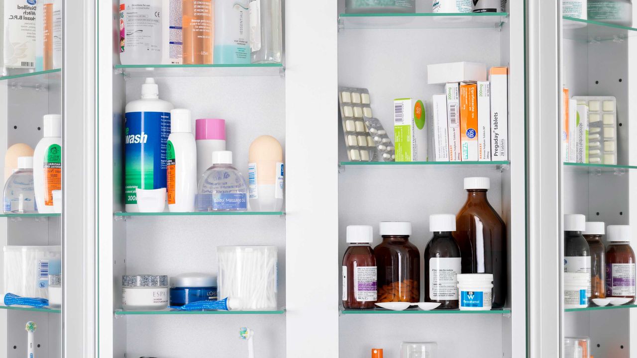 medicine cabinet with medication and toiletries