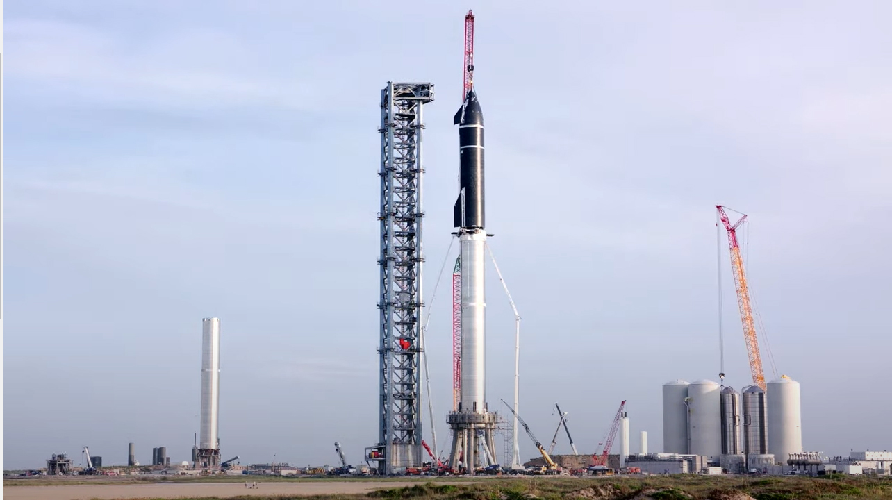 SpaceX's Starship is stacked atop its Super Heavy for the first time in August 2021 during tests of the new, giant reusable rocket.