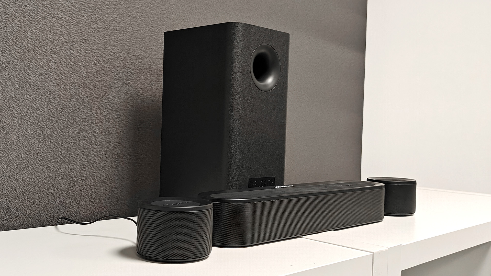 Majority Bowfell Halo Atmos soundbar system, all components on white shelving unit in test room