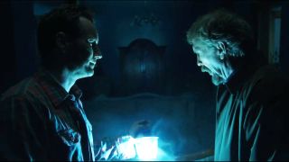 Steve Coulter looking at a light, and Patrick Wilson looking at Steve Coulter in Insidious: Chapter 2.