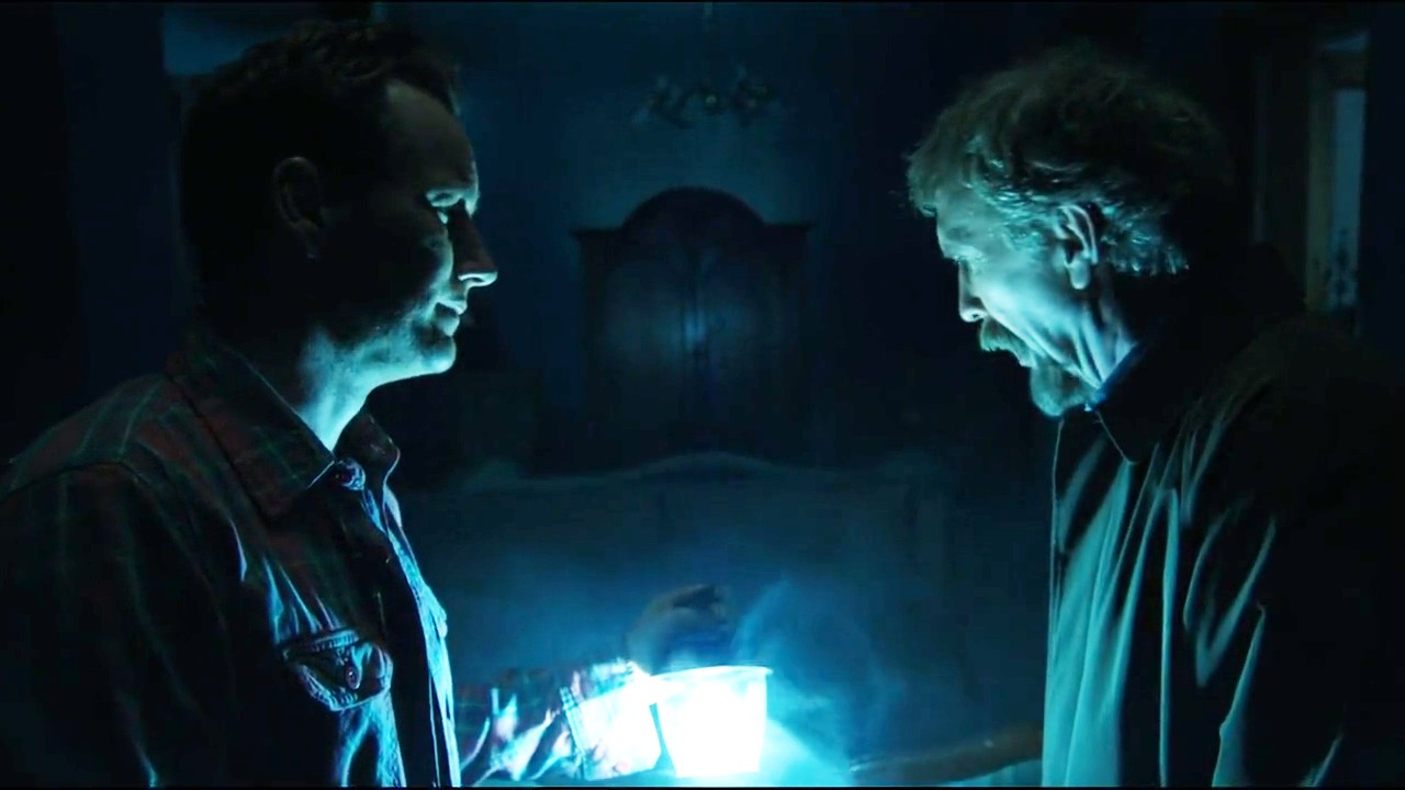 Steve Coulter looking at a light and Patrick Wilson looking at Steve Coulter in Insidious: Chapter 2.