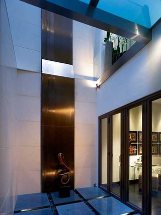 dramatic lightwell brings natural light to all three storeys of this London home