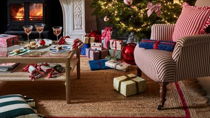 gifts under £100 christmas tree fireplace presents stripy armchair