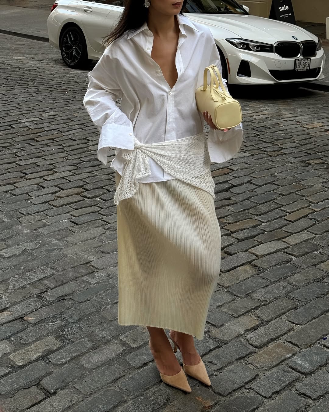 woman wearing neutral color pointed toe shoe trend 2025