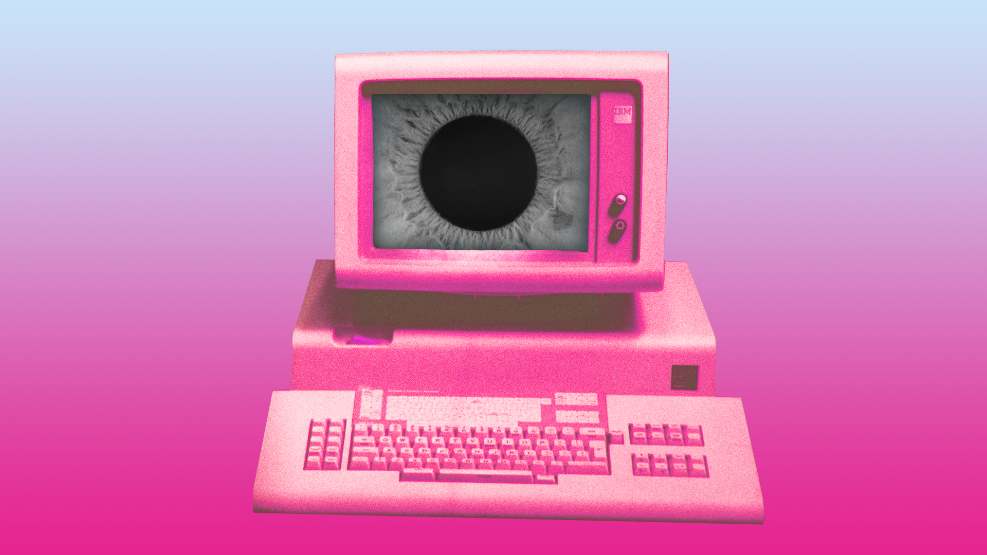 Un vieil IBM PC recoloré en rose avec un œil sinistre sur l'écran.