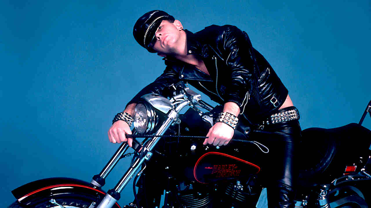 Judas Priest&amp;rsquo;s Rob Halford posing for a photograph on a motorbike in the early 1980s
