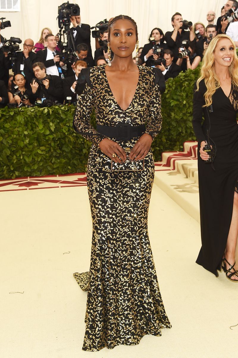 Clothing, Dress, Fashion model, Shoulder, Red carpet, Fashion, Carpet, Gown, Hairstyle, Neck,