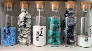 Labeled bottles to maintain organization under the kitchen sink