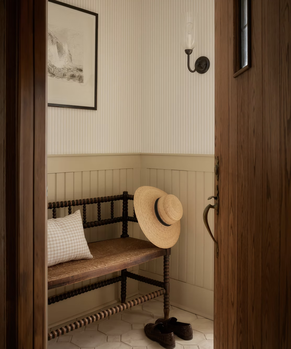 entryway with bench seating and wood panelling