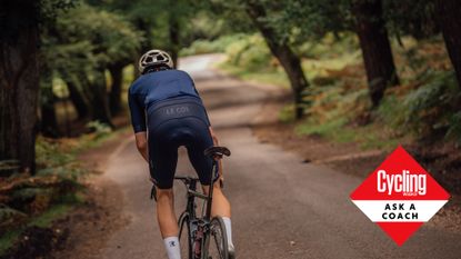 Male cyclist riding out the saddle