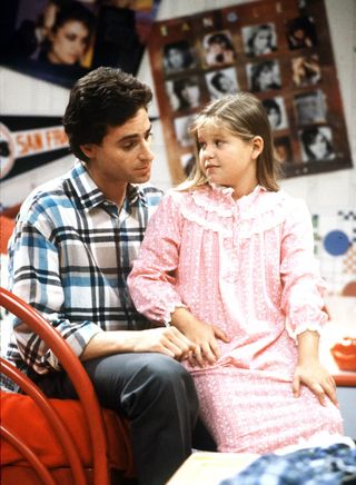 Bob Saget as danny tanner comforting Candace Cameron Bure as dj on 'Full House'