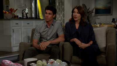 Finn (Tanner Novlan) and Steffy (Jacqueline MacInnes Wood) sitting in their living room in Malibu on The Bold and the Beautiful