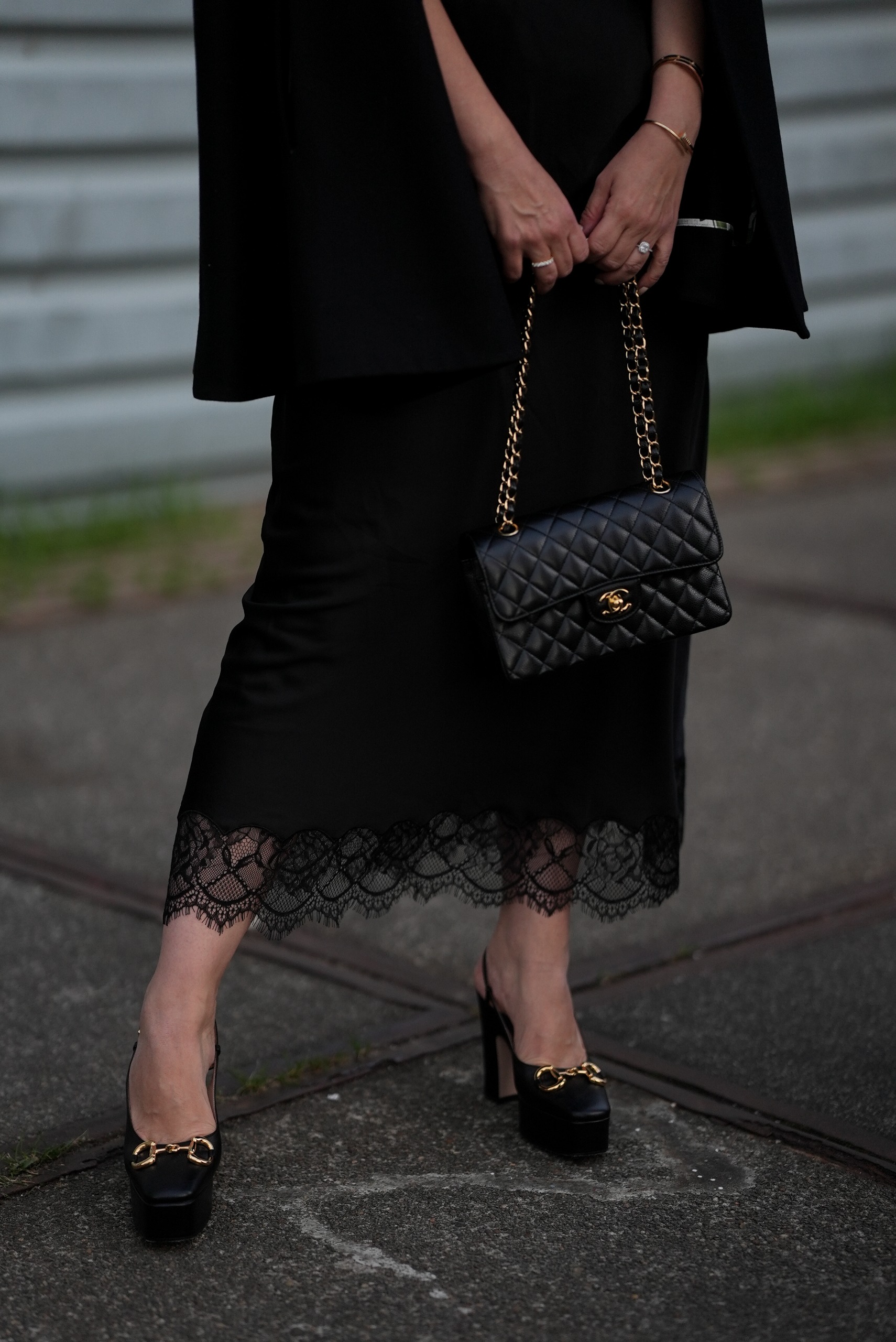 Woman holding a Chanel bag.