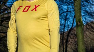 Detail of man in a yellow cycling jersey