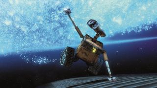 Still from the animated movie "WALL-E." A small, square, yellow robot with treads, two little arms, and binocular-like eyes. He is holding onto a spaceship as it flies through space. His other arm is stretched out above him as he reaches up to touch some bright blue space bubbles.