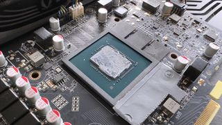 A photo of an RTX 4070 Ti with its heatsink removed, showing the factory-applied thermal paste on the GPU die