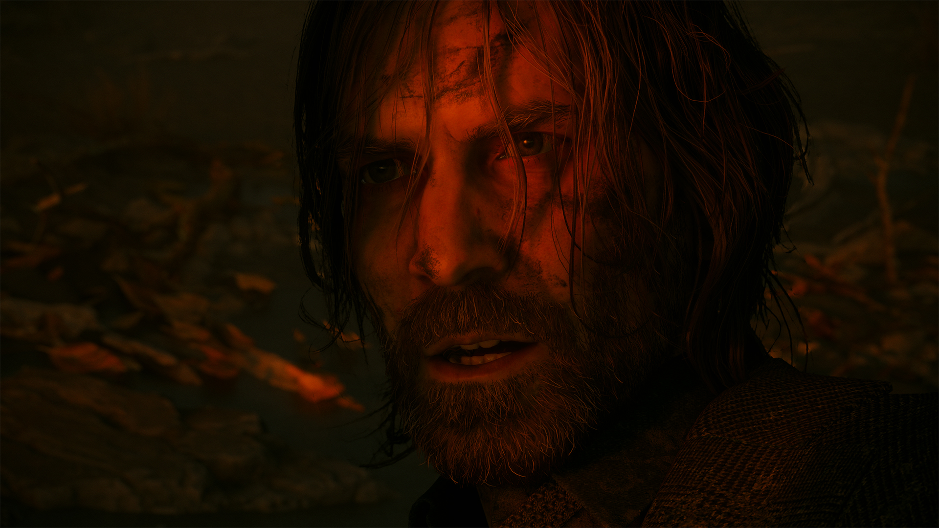 A grizzled Alan Wake, with his face bathed in red light