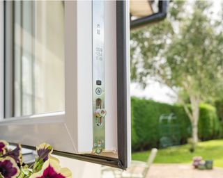 Brand new installed double glazing windows seen in a house annex. Detail of the multiple window locks can rubber window sealing is visible