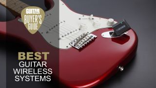 Guitar wireless system plugged into a red Strat-style guitar