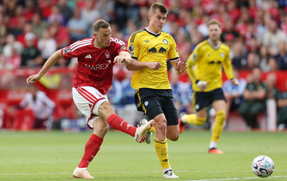Chris Wood of Nottingham Forest attempts to shoot while under pressure from Jaka Bijol of Leeds United during the Premier League 2026/27 match between Nottingham Forest FC and Leeds United at City Ground on August 22, 2026 in Nottingham, England.