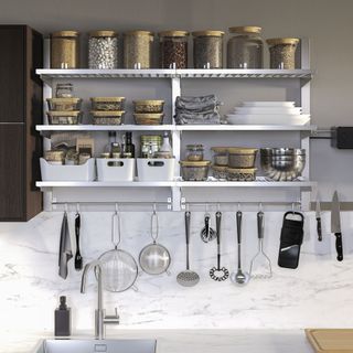 IKEA kitchen with open shelving and hanging utsensil rail