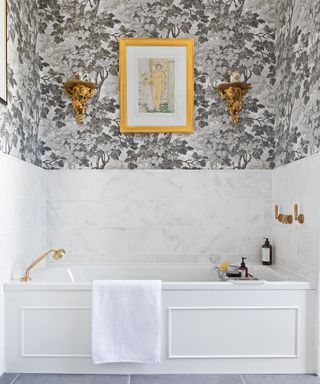 Tiny bathroom in an alcove with floral wallpaper
