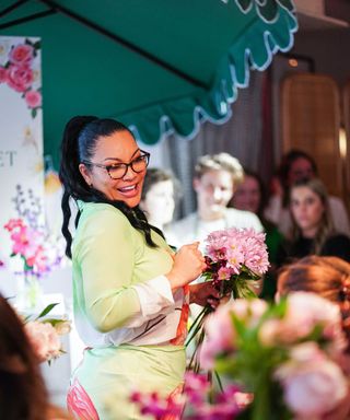 egypt sherrod holding flowers in new york