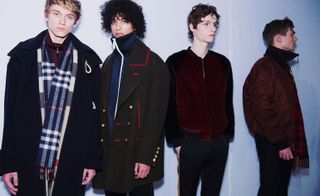 Four male models stood in Burberry coats