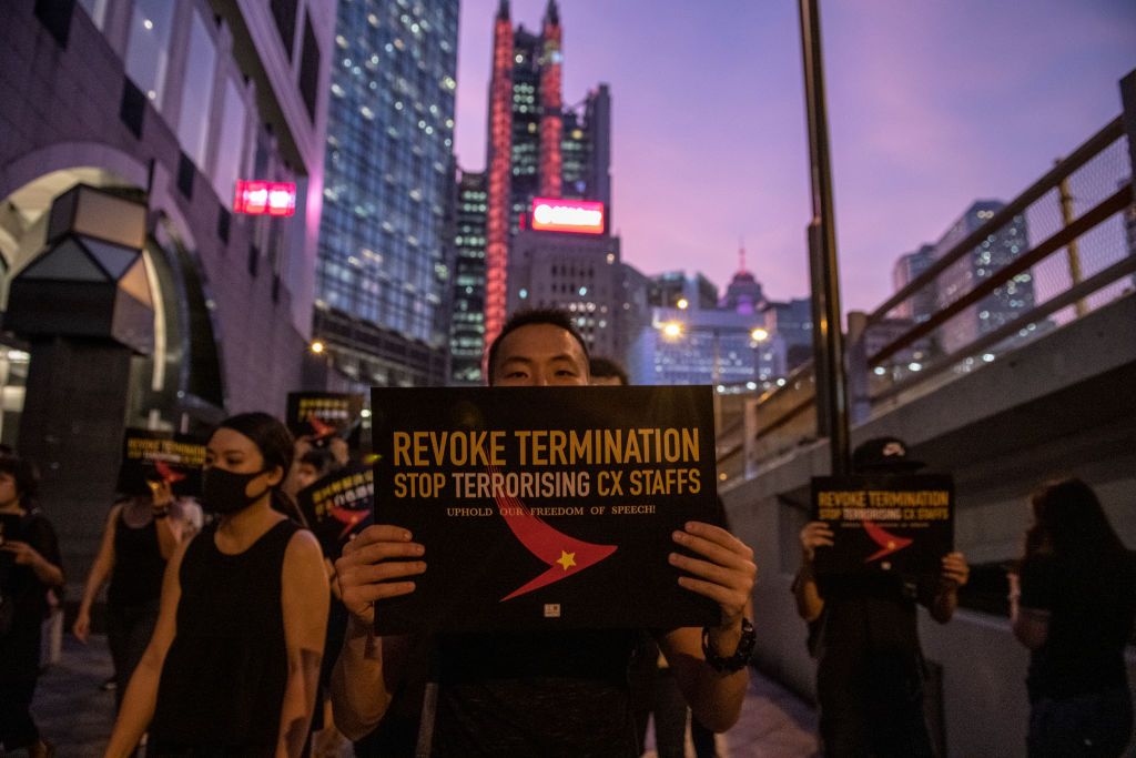 A Protester is seen holding up a placard during a rally in Hong Kong on August 28, 2019. Protester gather in Central in Protest of Cathay Pacific&amp;#039;s dismissal of numbers of employee allegedly 