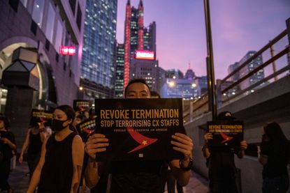 A Protester is seen holding up a placard during a rally in Hong Kong on August 28, 2019. Protester gather in Central in Protest of Cathay Pacific's dismissal of numbers of employee allegedly 