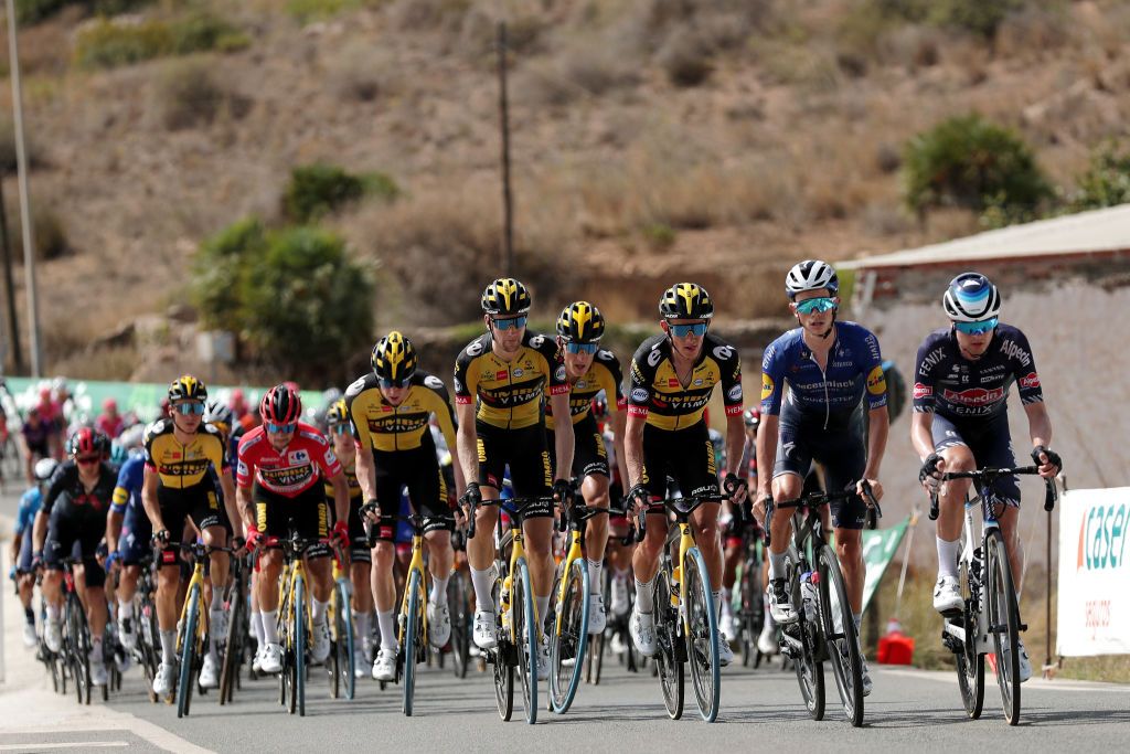 LA MANGA SPAIN AUGUST 21 LR Primoz Roglic of Slovenia and Team Jumbo Visma red leader jersey Lennard Hofstede of Netherlands and Team Jumbo Visma Koen Bouwman of Netherlands and Team Jumbo Visma James Knox of United Kingdom and Team Deceuninck QuickStep Jay Vine of Australia and Team AlpecinFenix and the peloton compete during the 76th Tour of Spain 2021 Stage 8 a 1737 km stage from Santa Pola to La Manga del Mar Menor lavuelta LaVuelta21 on August 21 2021 in La Manga Spain Photo by Gonzalo Arroyo MorenoGetty Images