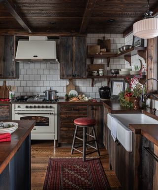 a log cabin kitchen with white appliances