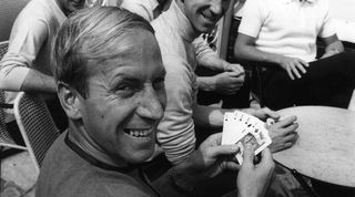 Bobby Charlton holds a full house in a game of cards with team mates (left to right) Peter Bonetti, Martin Peters, Jack Charlton and Bobby Moore. 10th July 1966. (Photo by Monte Fresco/Daily Mirror/Mirrorpix via Getty Images)