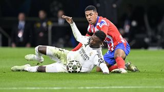 Eduardo Camavinga (L) of Real Madrid in action against the Samuel Lino (R) of Atletico Madrid during the UEFA Champions League round of 16 first-leg match between Real Madrid and Atletico Madrid at Santiago Bernabeu Stadium in Madrid, Spain on March 04, 2025.