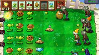 Zombies being held at bay by plants in Plants vs Zombies.
