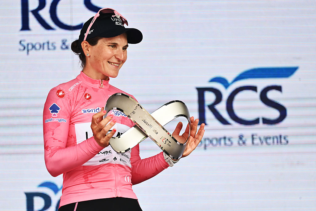 IMOLA, ITALY - JULY 13: Elisa Longo Borghini of Italy and UAE Team ADQ - Pink Leader Jersey celebrates at podium as overall final race winner during the 36th Giro d'Italia Women 2025, Stage 8 a 134km stage from Forli to Imola / #UCIWWT / on July 13, 2025 in Imola, Italy. (Photo by Luc Claessen/Getty Images)