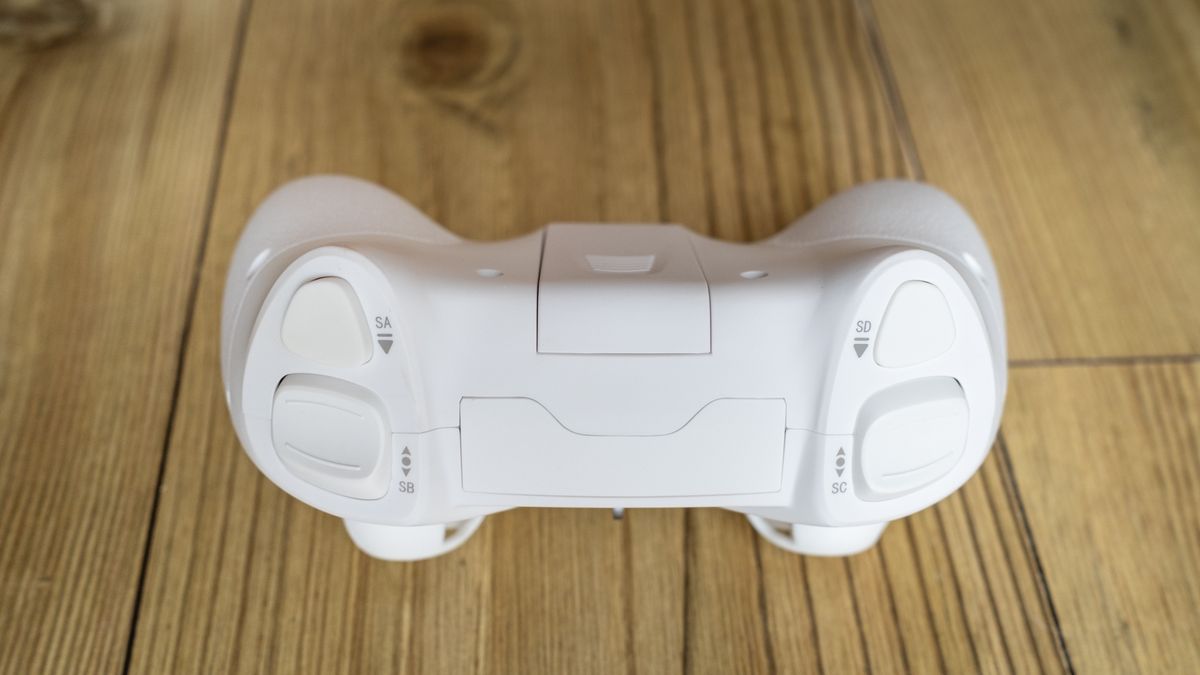 BetaFPX Cetus X drone controller on wooden table closeup of the top of controller