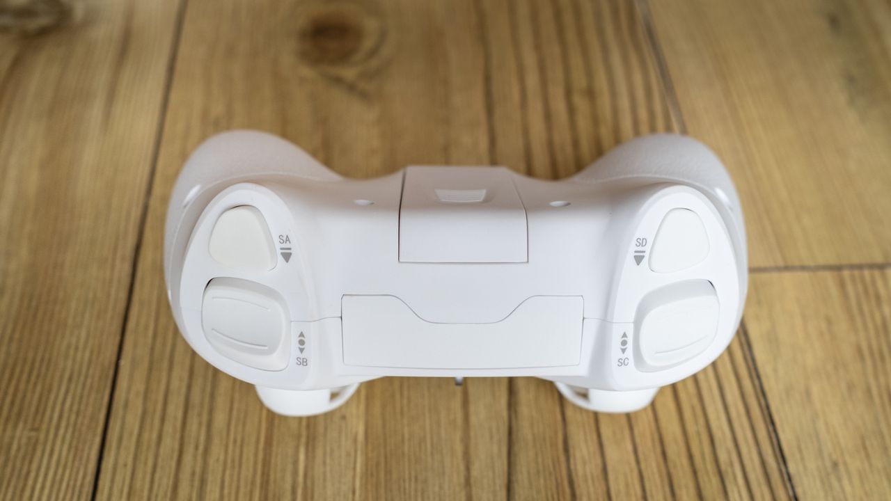 BetaFPX Cetus X drone controller on wooden table closeup of the top of controller