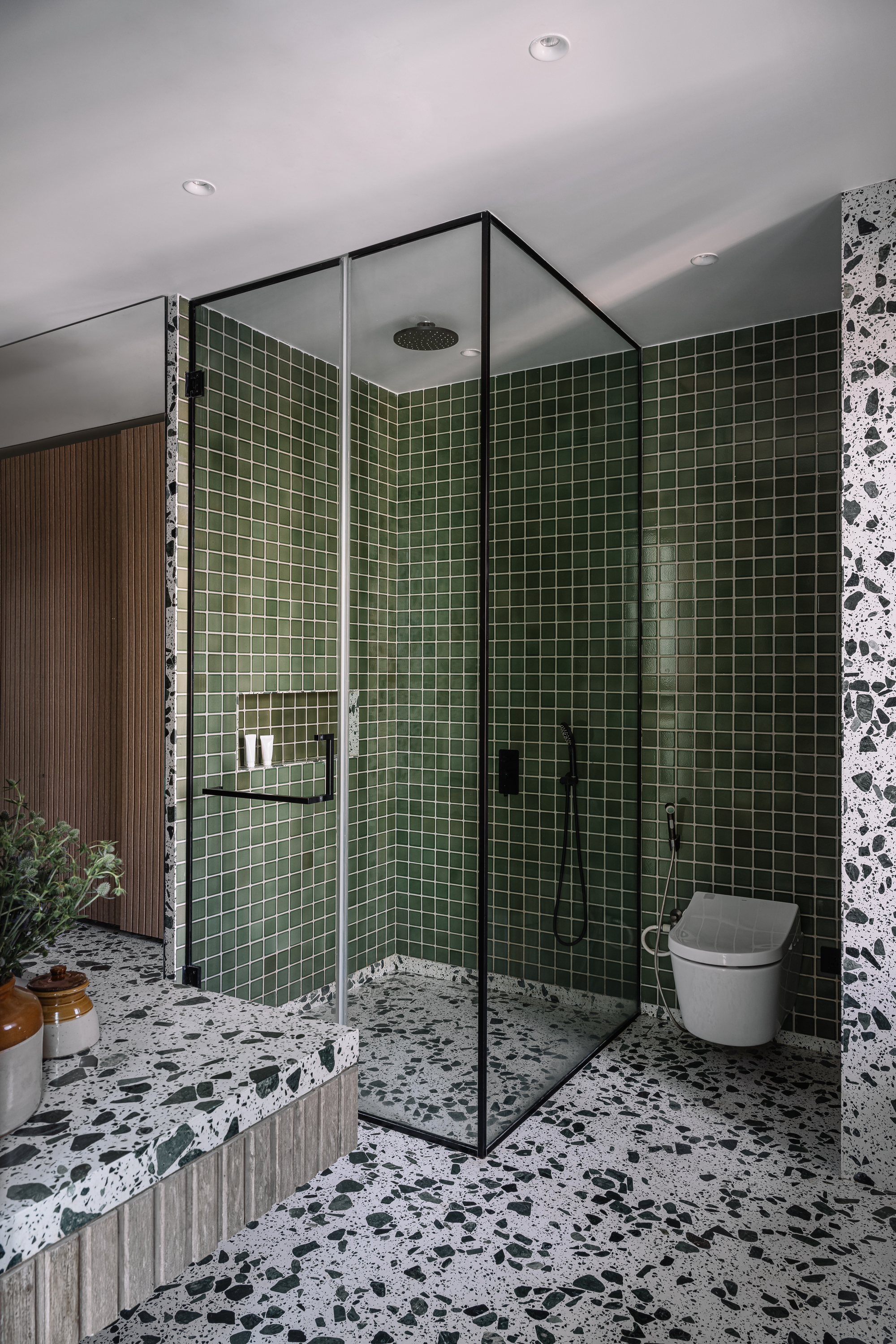 A bathroom with heavily speckled terrazzo tiles