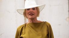 Sharon Stone in silky olive green outfit