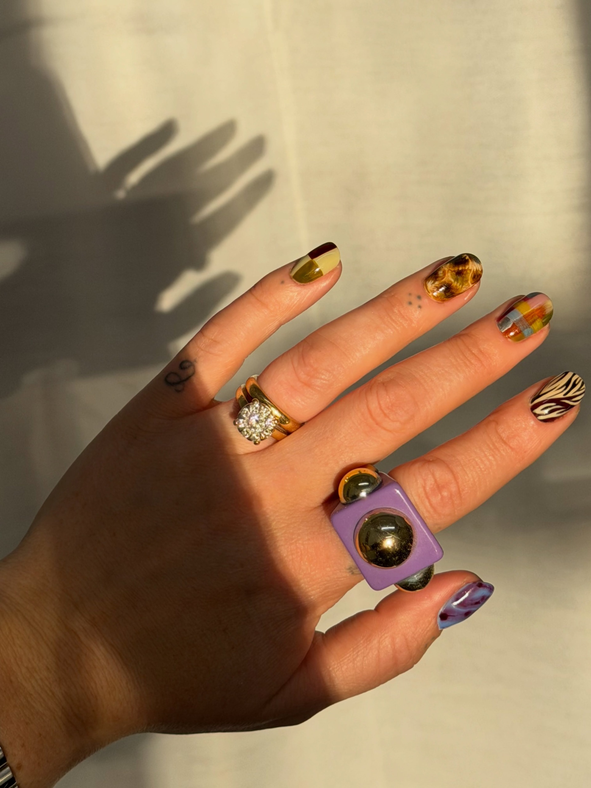 zebra print tortoiseshell plaid and little pops of chartreuse green all mixed together