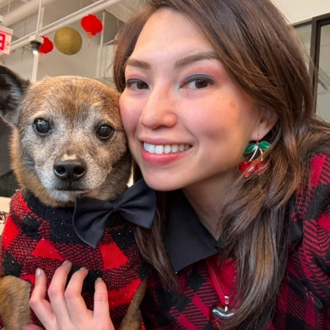 Sarah and Duke wearing matching tartan red outfits