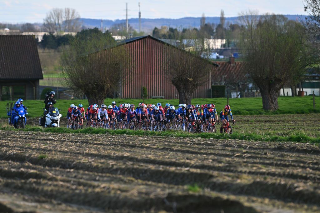 WAREGEM BELGIUM MARCH 27 A general view of the peloton passing through a landscape during the 12nd Dwars door Vlaanderen 2024 Womens Elite a 1299km one day race from Waregem to Waregem on March 27 2024 in Waregem Belgium Photo by Luc ClaessenGetty Images