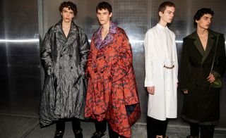 2 male models in large coats