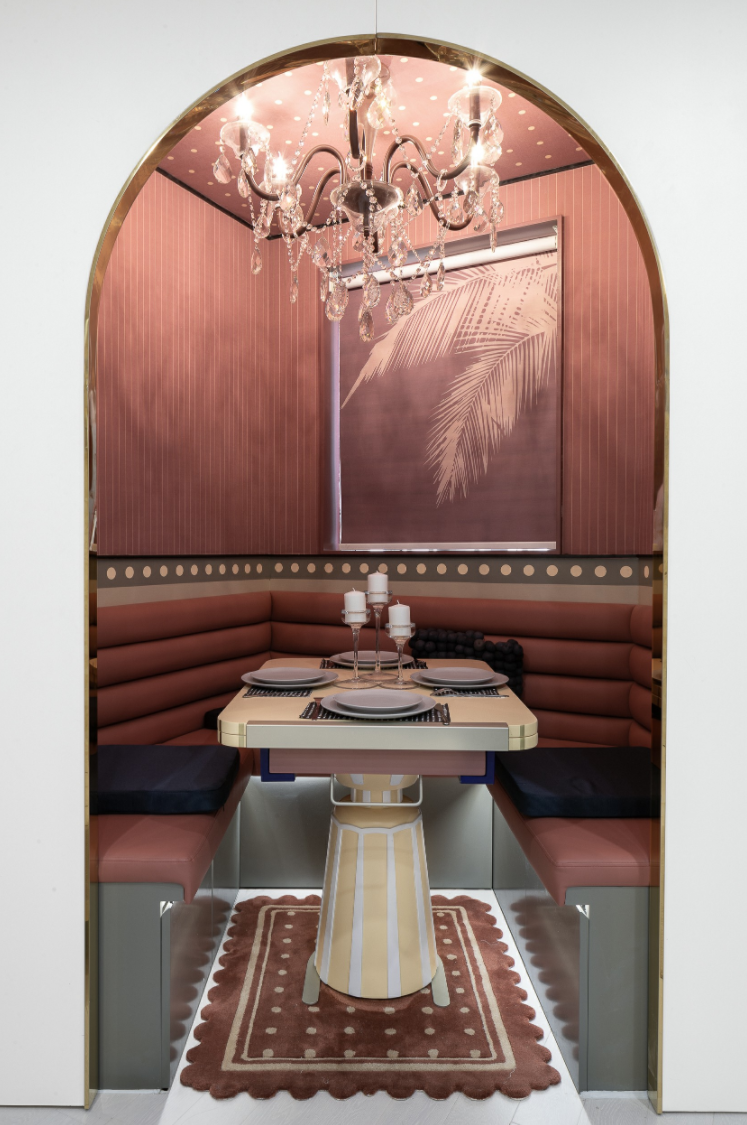 Pink dining nook in an arched alcove