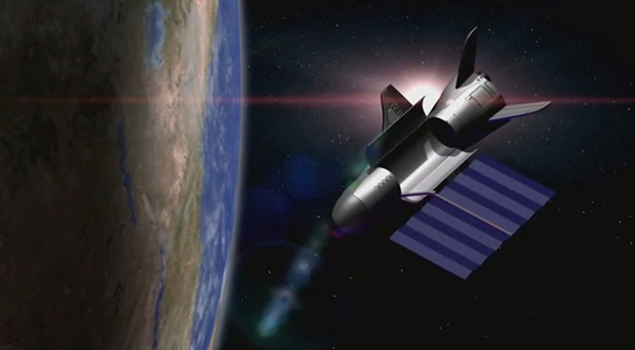 An artist&#039;s depiction of the U.S. Air Force&#039;s unmanned X-37B space plane in orbit with its solar array deployed and payload bay open.